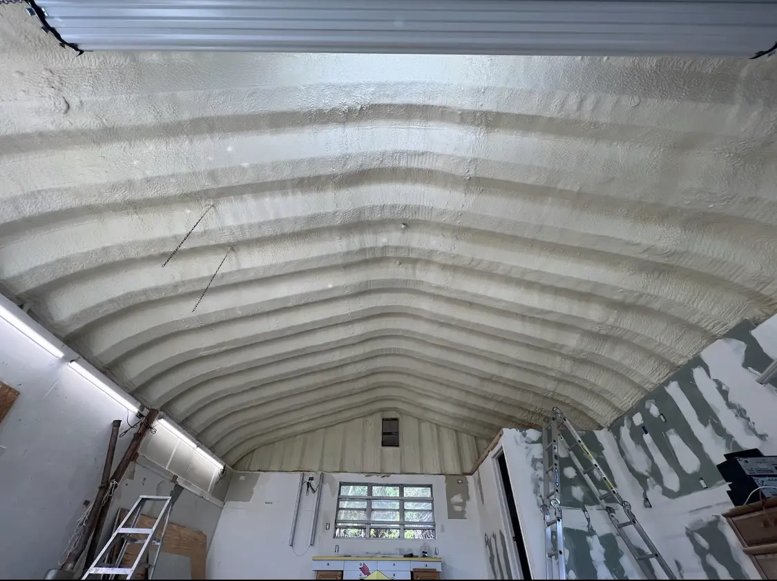 Spray polyurethane foam applied to the underside of a metal roof deck in Evanston